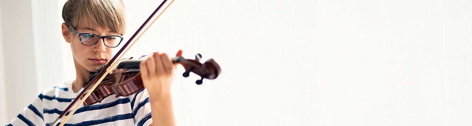 Young girl playing violin